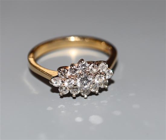 A modern 18ct gold and diamond cluster ring, size M, gross 3.2 grams.